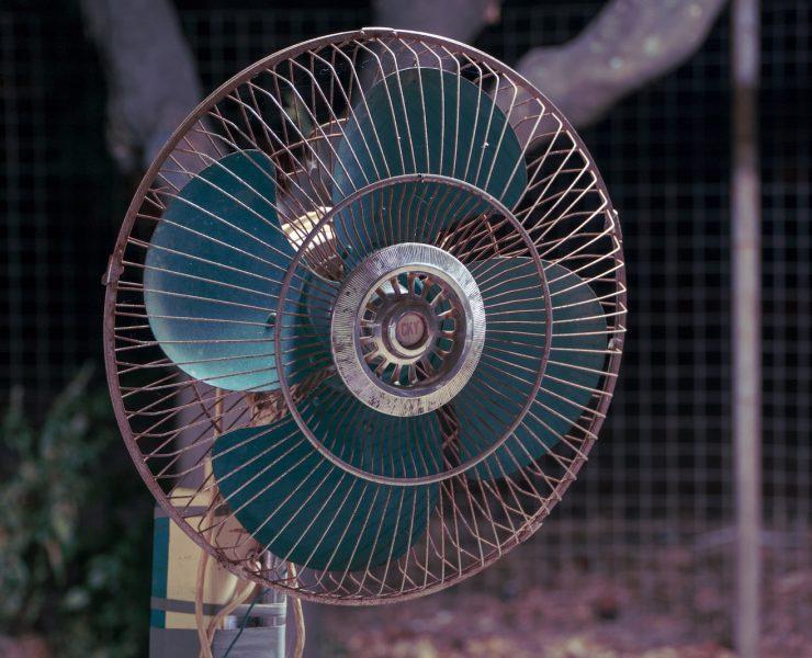 white and blue desk fan