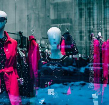 women's red coat on white mannequin