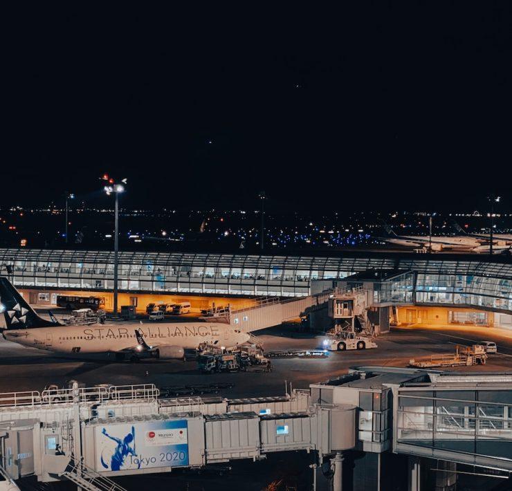 a large jetliner sitting on top of an airport tarmac