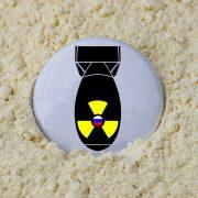 a black and yellow object on a white surface