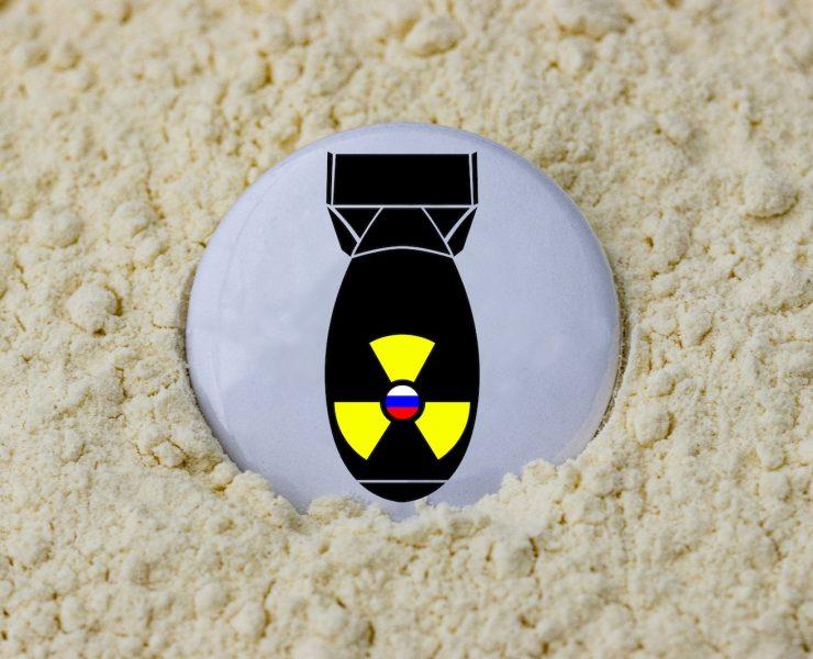 a black and yellow object on a white surface