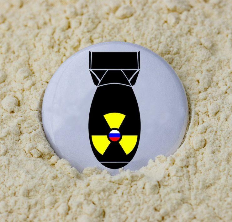 a black and yellow object on a white surface