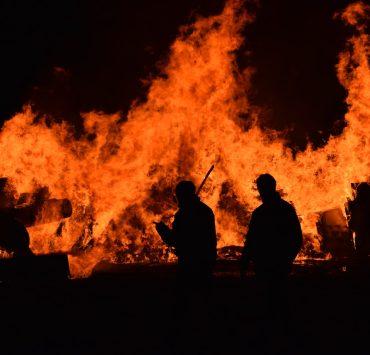 people walking near fire