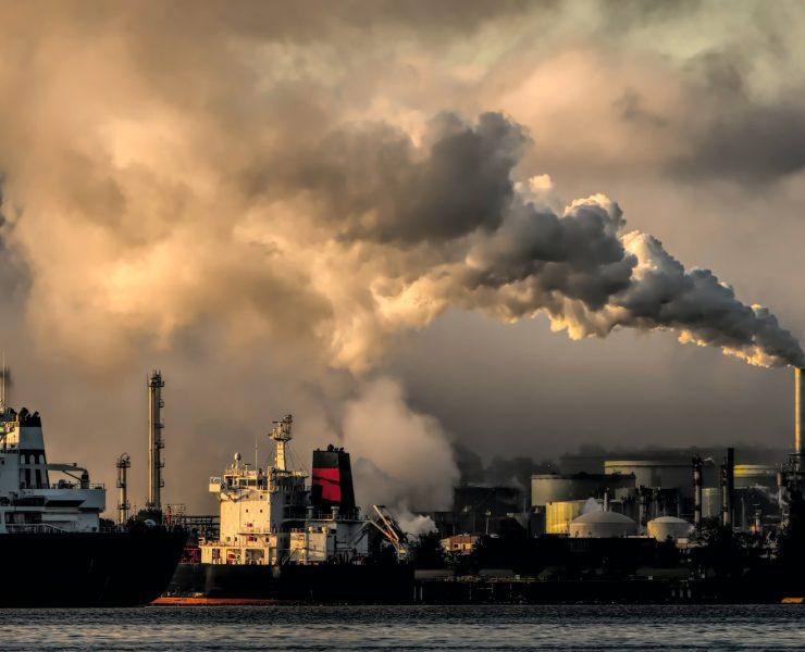 white and black ship on sea under white clouds