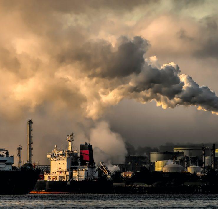 white and black ship on sea under white clouds