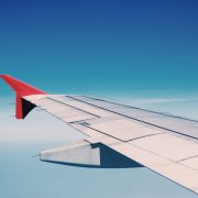 white and red airplane wing