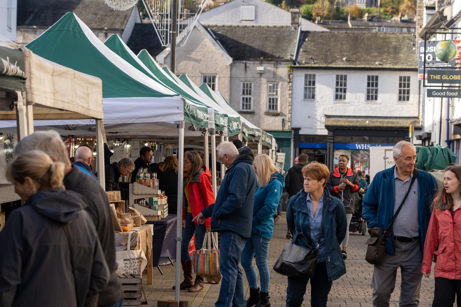a group of people at an outdoor market