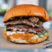 a close up of a hamburger on a tray