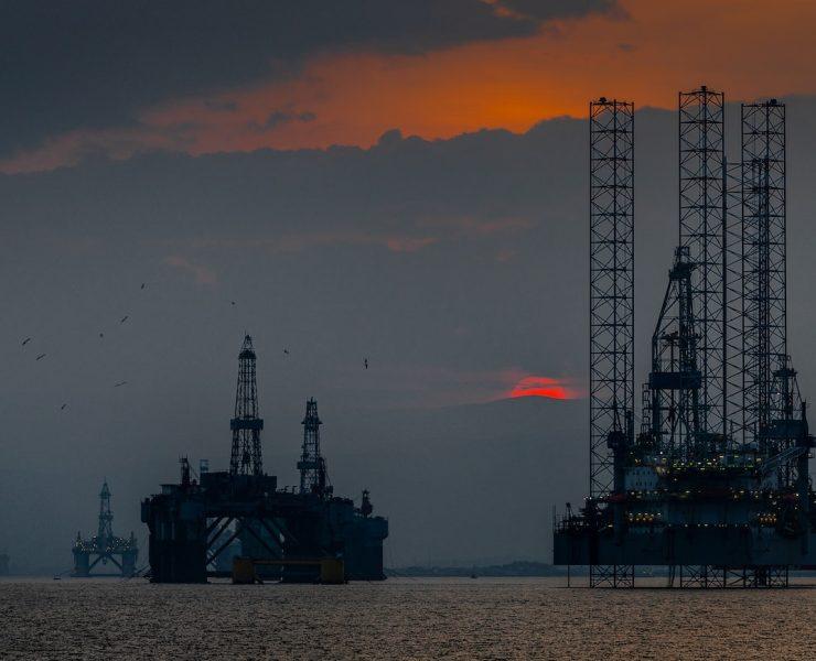 a group of oil rigs in the ocean
