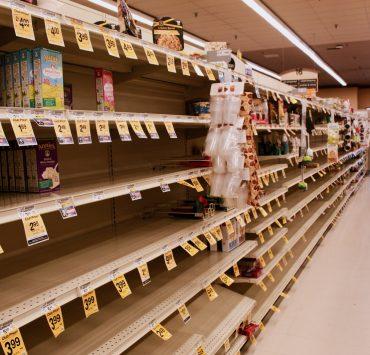 brown wooden shelf with boxes