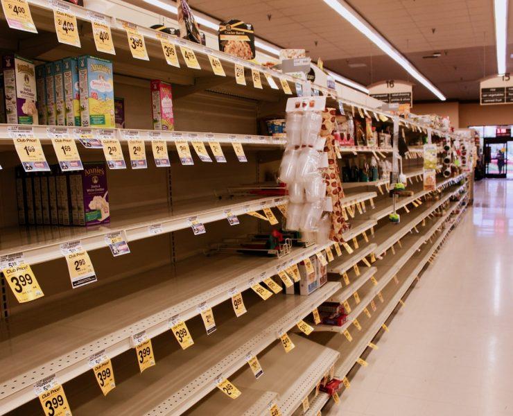 brown wooden shelf with boxes
