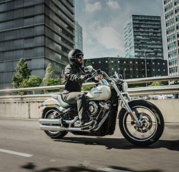 man riding cruiser motorcycle