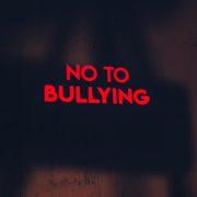 a red sign that says no to bullying