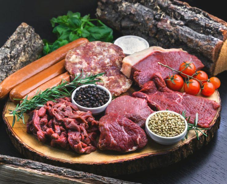 raw meat on white ceramic plate