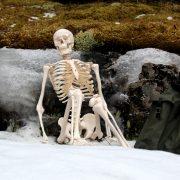 white ceramic figurine on white snow