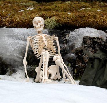 white ceramic figurine on white snow