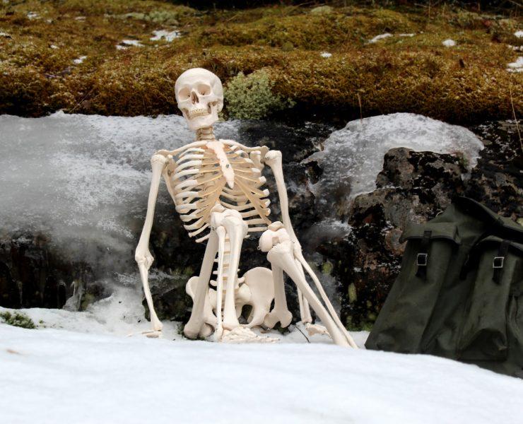 white ceramic figurine on white snow