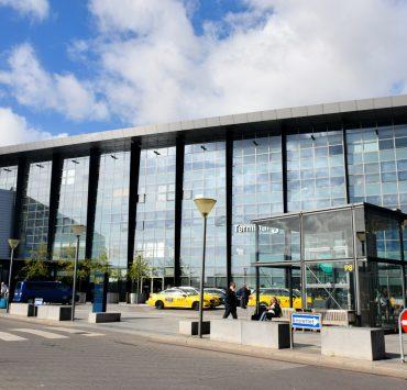 a large building with a lot of windows on the side of it