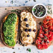 assorted fruits and vegetable on brown wooden chopping board