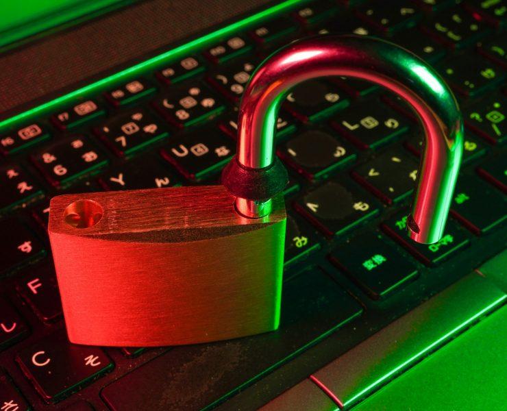 red padlock on black computer keyboard