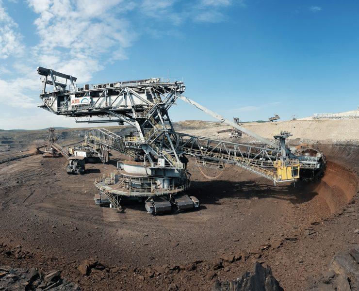 white and black airplane on brown sand during daytime