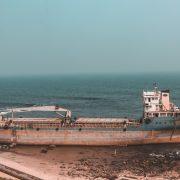 brown ship on sea during daytime