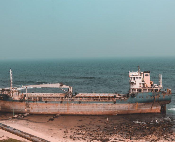 brown ship on sea during daytime
