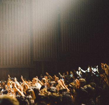 people raising their hands