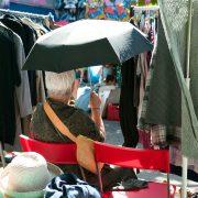 a person sitting under an umbrella