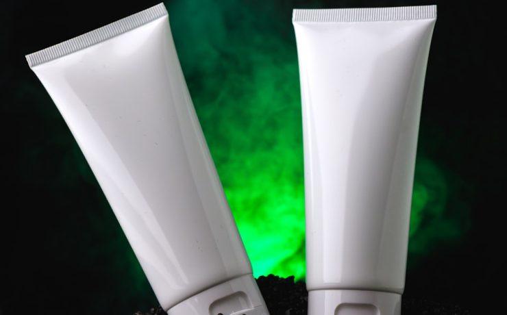 a couple of white tubes sitting on top of a pile of dirt