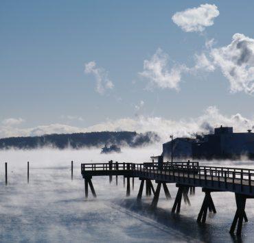 black wooden dock on body of water under blue sky during daytime