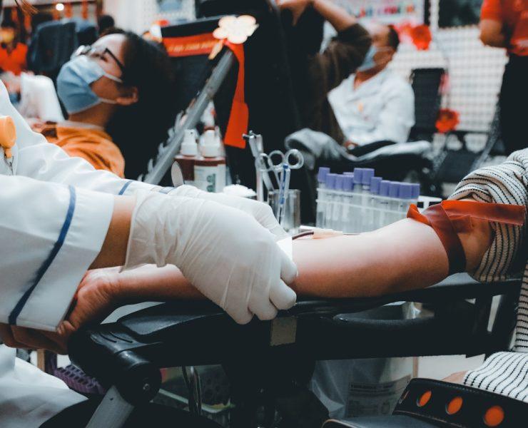 woman in white long sleeve shirt and white pants doing exercise