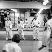 grayscale photo of people walking on the street