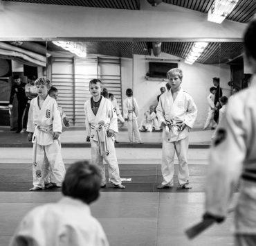 grayscale photo of people walking on the street