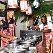 Three Woman and Man Wearing Apron