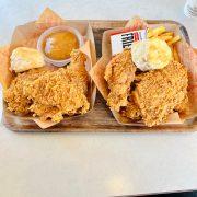 a couple of trays of food on a table