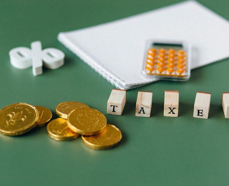 Gold Coins on Green Surface