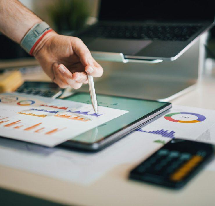 a person is writing on a piece of paper